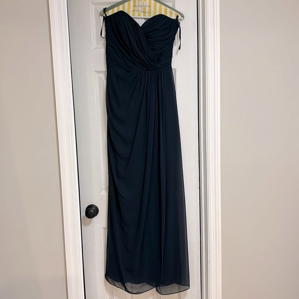 Navy blue bridesmaid dress. Worn once and dry cleaned. No flaws. Great dress!